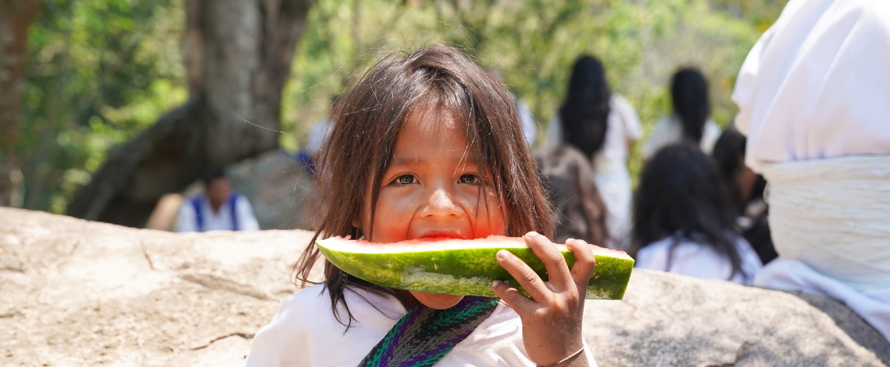 Child eating watermelon La Guajira Colombia