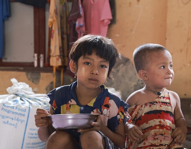 A family from Sittwe township, Rakhine State enjoys lunch with food assistance provided by WFP in the immediate aftermath of Cyclone Mocha.