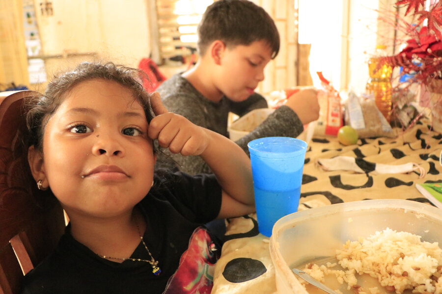 Kim eats lunch at home in La Vela de Coro, Venezuela